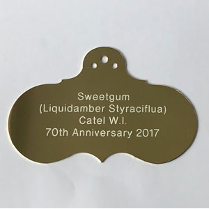 Brass Victorian style plant label with white text from Metallic Garden